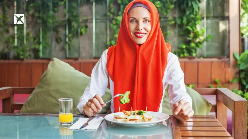 Muslin woman enjoying halal food